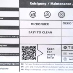 Oznaka Nepal s tehničkim podacima tkanine, uputama za održavanje i QR kodom.